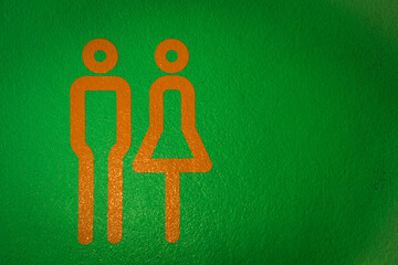 green man and woman sign for toilet directions