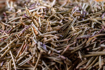Closeup of dried rosemary leaves. Rosemary texture. Very popular and healthy seasoning worldwide.
