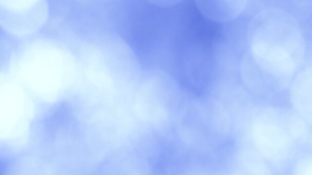 Abstract blurry bokeh background of changing with different colors blurry round spots.