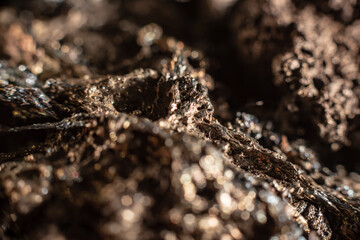 Macro of slag or volcanic magma stone texture, similar to a landscape of a strange space planet