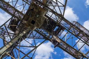 old metal tower crane in a steelworks