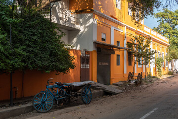 Old French era buildings lining a quiet street in Pondicherry