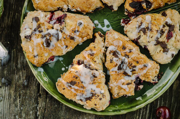 Cranberry & Cherry Scones. Baking on an old wooden table in rustic style.