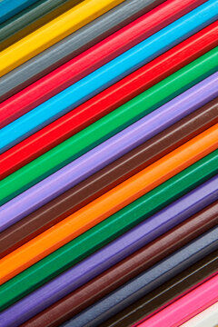 Multicolored pensil's wooden background.