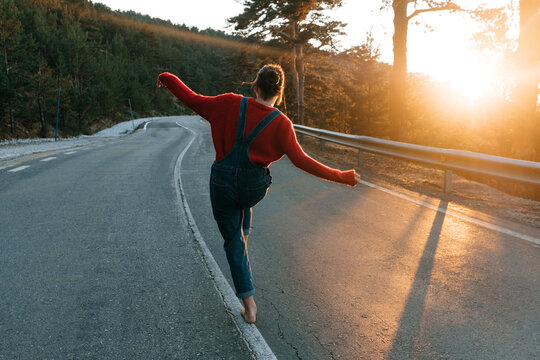 walking on the road at sunset. - Powered by Adobe