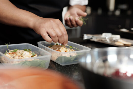 Unrecognizable Woman Adding Herbs
