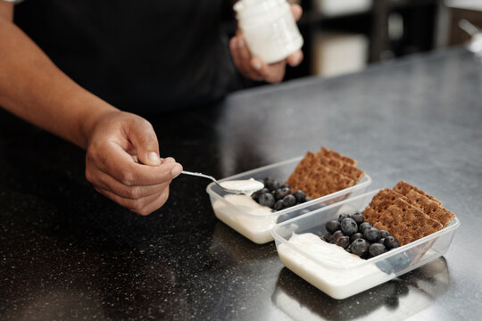Woman Making Healthy Breakfast Boxes
