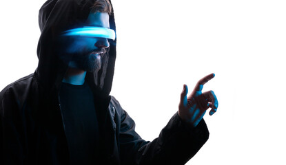 Young man in hoodie on white background. Guy using VR helmet. Augmented reality, future technology, game concept. Blue neon light.