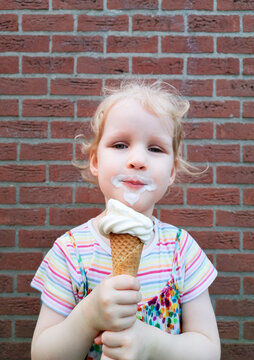 Toddler eats ice cream