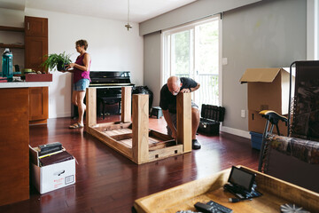 Mature couple packing up house to move