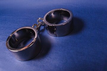 iron handcuffs Bdsm on a blue background