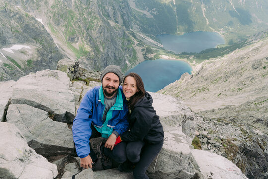 Married couple successfully climbed to peak of mountain.