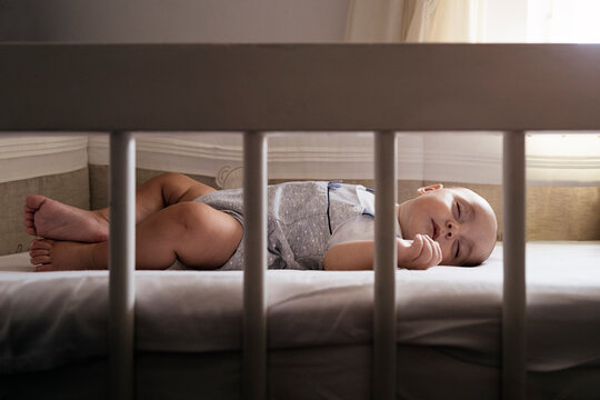 Cute baby sleeping on the crib