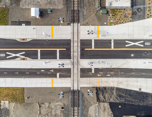 Aerial drone bird's eye view of a railroad crossing