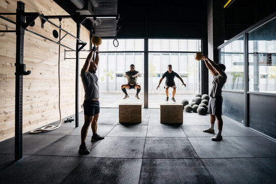 A group of men training in a crossfit box