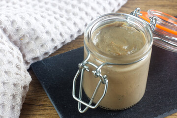 Homemade liver pate in the old glass.