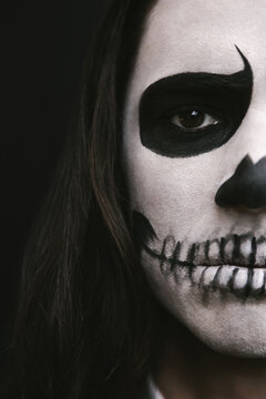 portrait of young man with skull Halloween facepaint