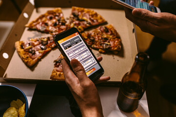 Friends watching a soccer match at home