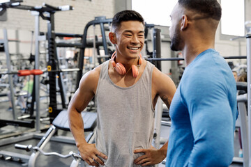 Two attractive men training, building strength.