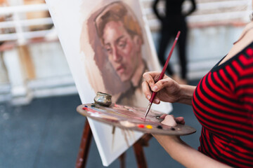 Artist using painter palette.