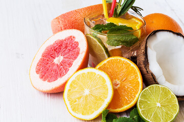 Half a citrus fruit with a summer drink