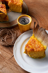 .Corn cake in the straw. Home made cake. Typical of Brazil and South America. Accompanied by a cup of coffee