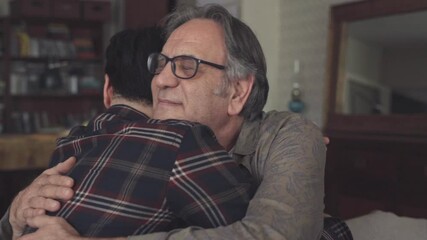 Young son embracing his father with love