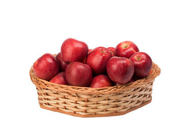 red apples in wicker basket on isolated white background