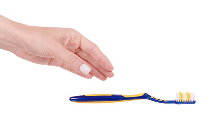 Hand with blue and yellow plastic toothbrush, dental care. Isolated on white background.