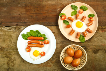 On the wooden board there is breakfast - two plates with fried eggs and chicken eggs.