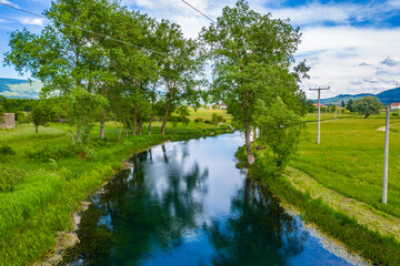 Fototapeta na wymiar Beautiful nature, colorful Gacka river valley, summer view, Lika region of Croatia