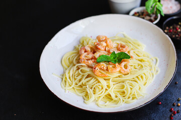 pasta shrimp
spaghetti creamy seafood sauce main dish
food background top view copy space for text
organic healthy eating