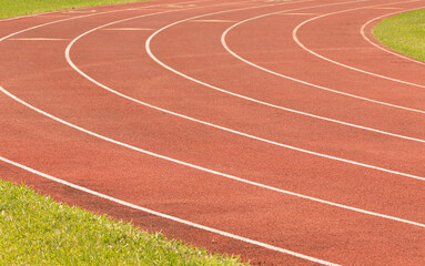 Fototapeta premium Red running track with white stripes