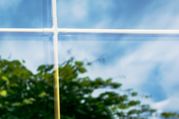 A fragment of a plastic laminated window