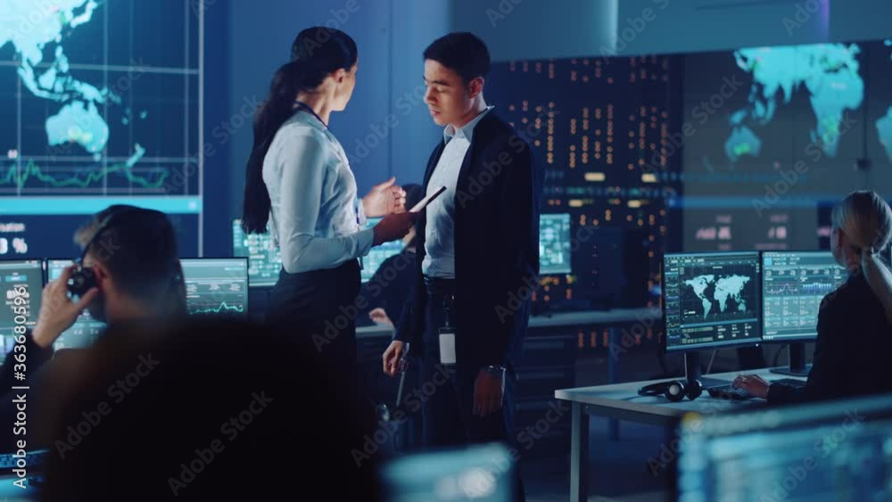 Poster Project Manager and Computer Science Engineer Talking while Using A Digital Tablet Computer. Telecommunications Company System Control and Monitoring Office Room with Working Specialists.