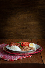 Traditional dish of Brazilian food. Rustic wood background.