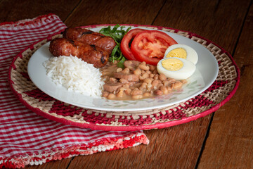 Traditional dish of Brazilian food. Rustic wood background.