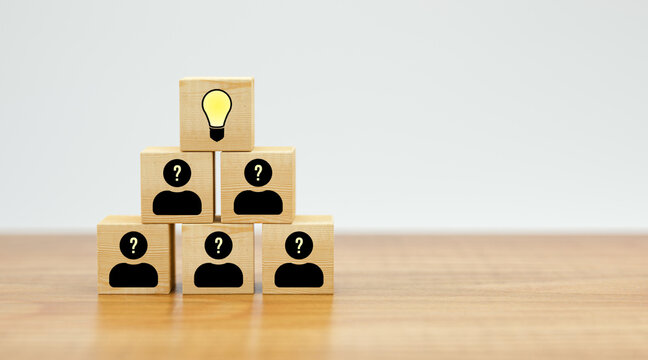 cubes showing a brainstorming session on wooden floor