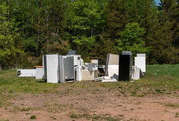 Naklejka premium PIle of defunct refrigerators at landfill