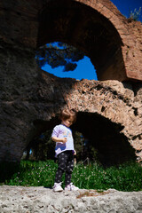a little girl playing in the old park