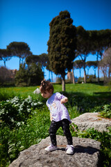 a little girl playing in the park