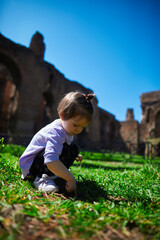 a little girl playing in the park