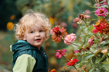 Little boy playing and gardening in back yard © Jan