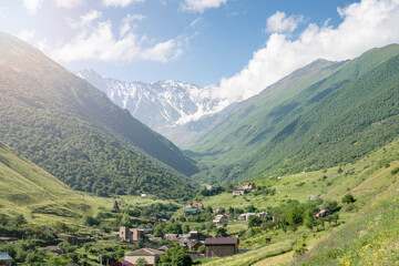 Fototapeta na wymiar Fantastic view of highest mountain village in mountains with cloudy sky. Beautiful landscape Caucasus.