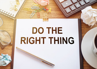 The phrase Do The Right Thing typed on a paper on office table. A reminder to make the right...