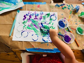 Toddler doing Arts and Crafts, Painting at the Kitchen Table