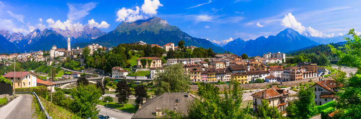 Fototapeta na wymiar Breathtaking panorama of beautiful Belluno town surrounded by Dolomite mountains, northern Italy