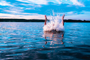 Finnish girl swimming in the lake during warm scandinavian midsummer, blue, water, splashing, lovely, woman, nature, natural,