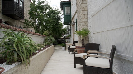 Fototapeta na wymiar Elegant garden furniture on terrace of suburban home