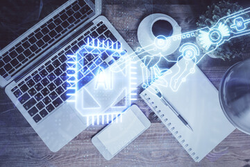 Multi exposure of data theme drawing hologram over topview work desk background with computer. Concept of technology.